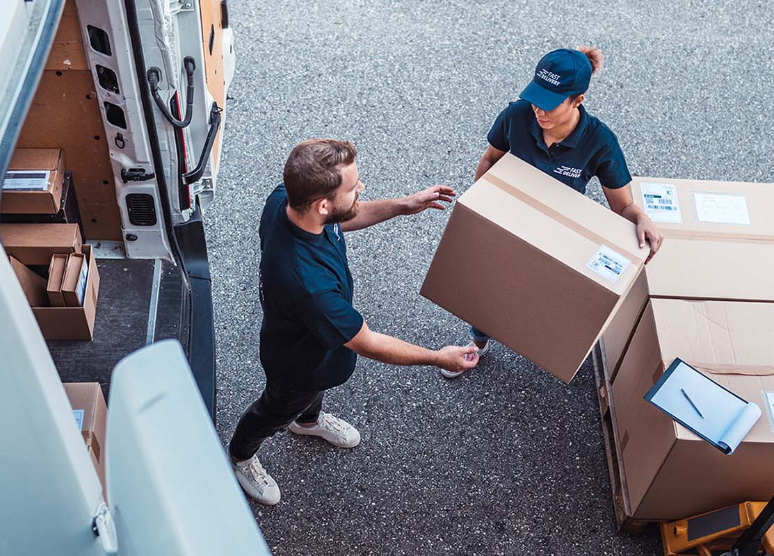 Cheva Logistics delivery team loading packages into a delivery van
